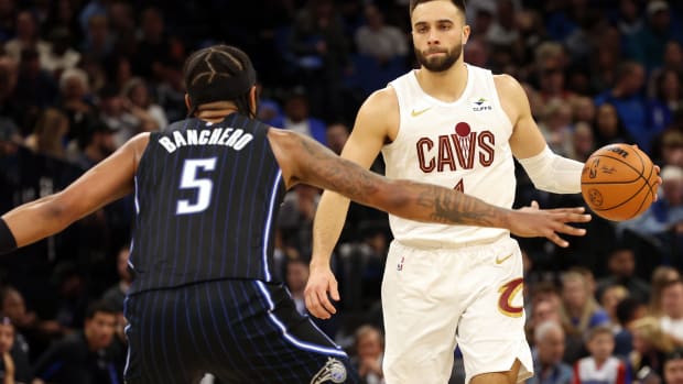 Jan 22, 2024; Orlando, Florida, USA; Cleveland Cavaliers guard Max Strus (1) dribbles as Orlando Magic forward Paolo Banchero (5) defends during the second quarter at Kia Center.